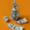 a stack of money sitting on top of a table