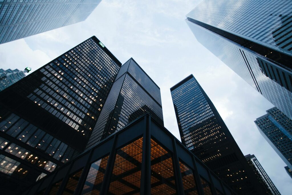 low angle photo of city high rise buildings during daytime business telecom shopping guide