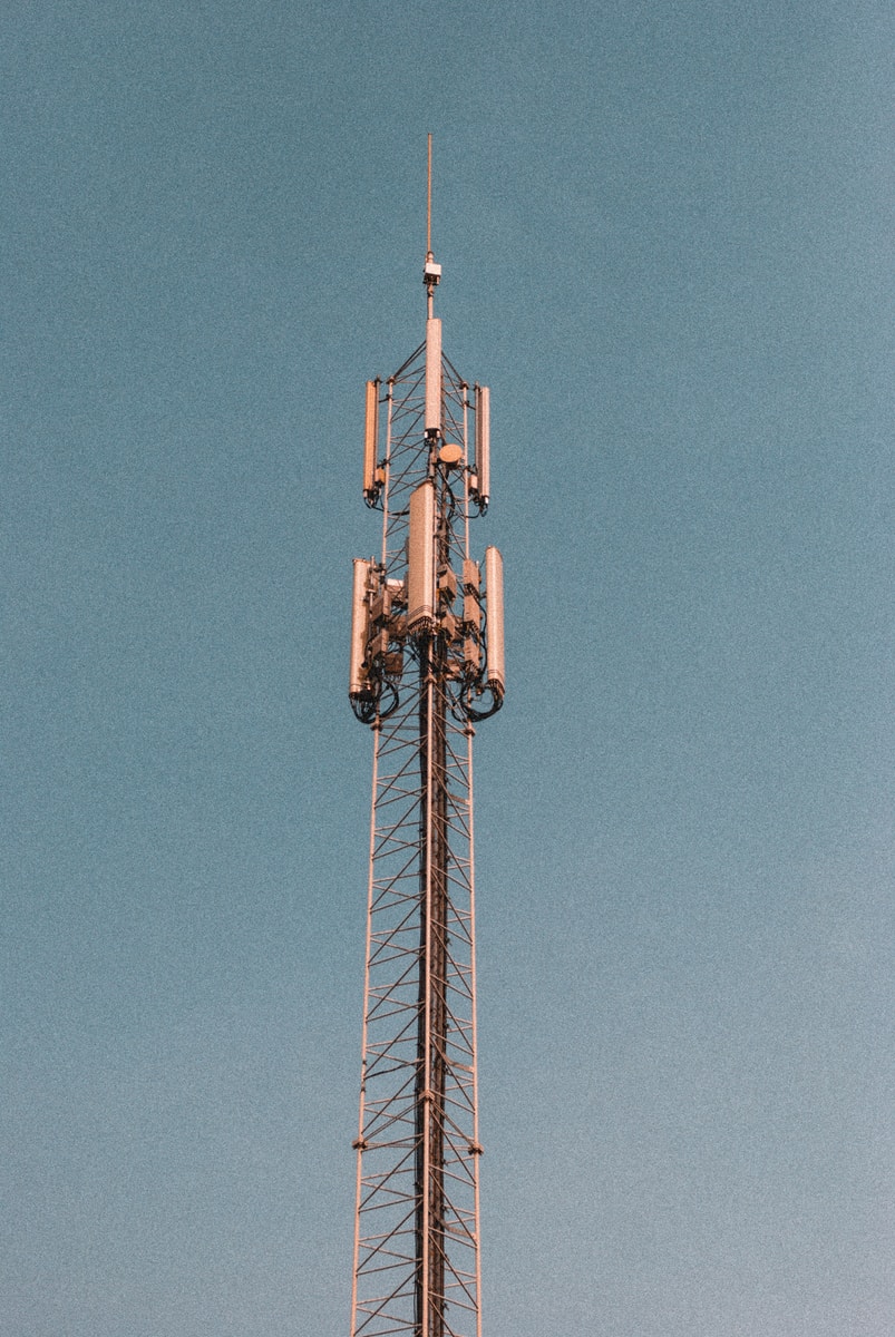 brown and white tower under blue sky during daytime 5G internet